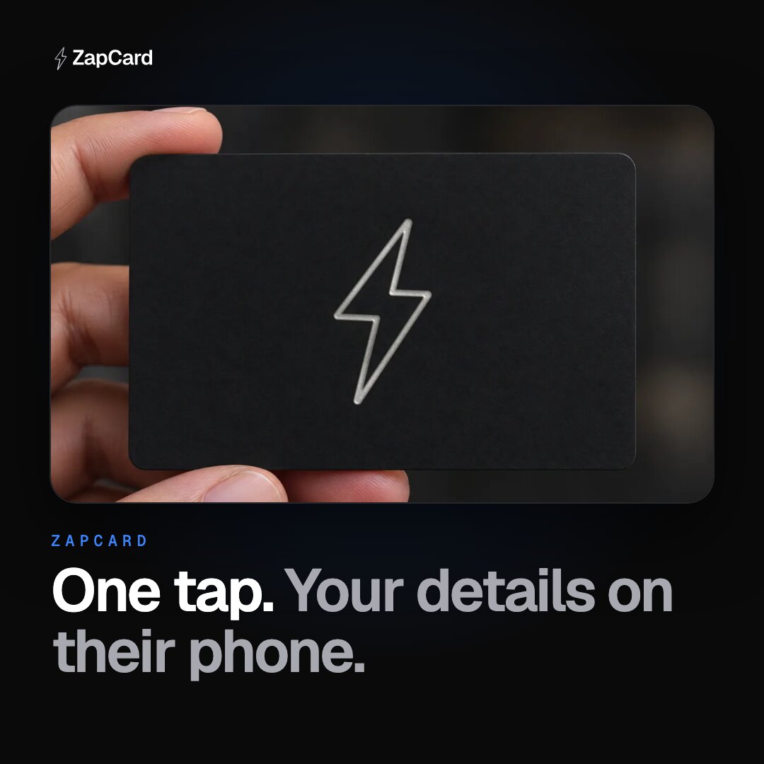 A matte black ZapCard with a silver foil bolt, held in a hand